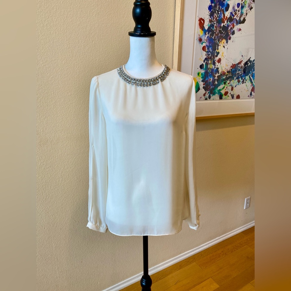 Jennifer Lopez Sheer Cream Blouse with Long Cutout Sleeves and Sparkly Trim
